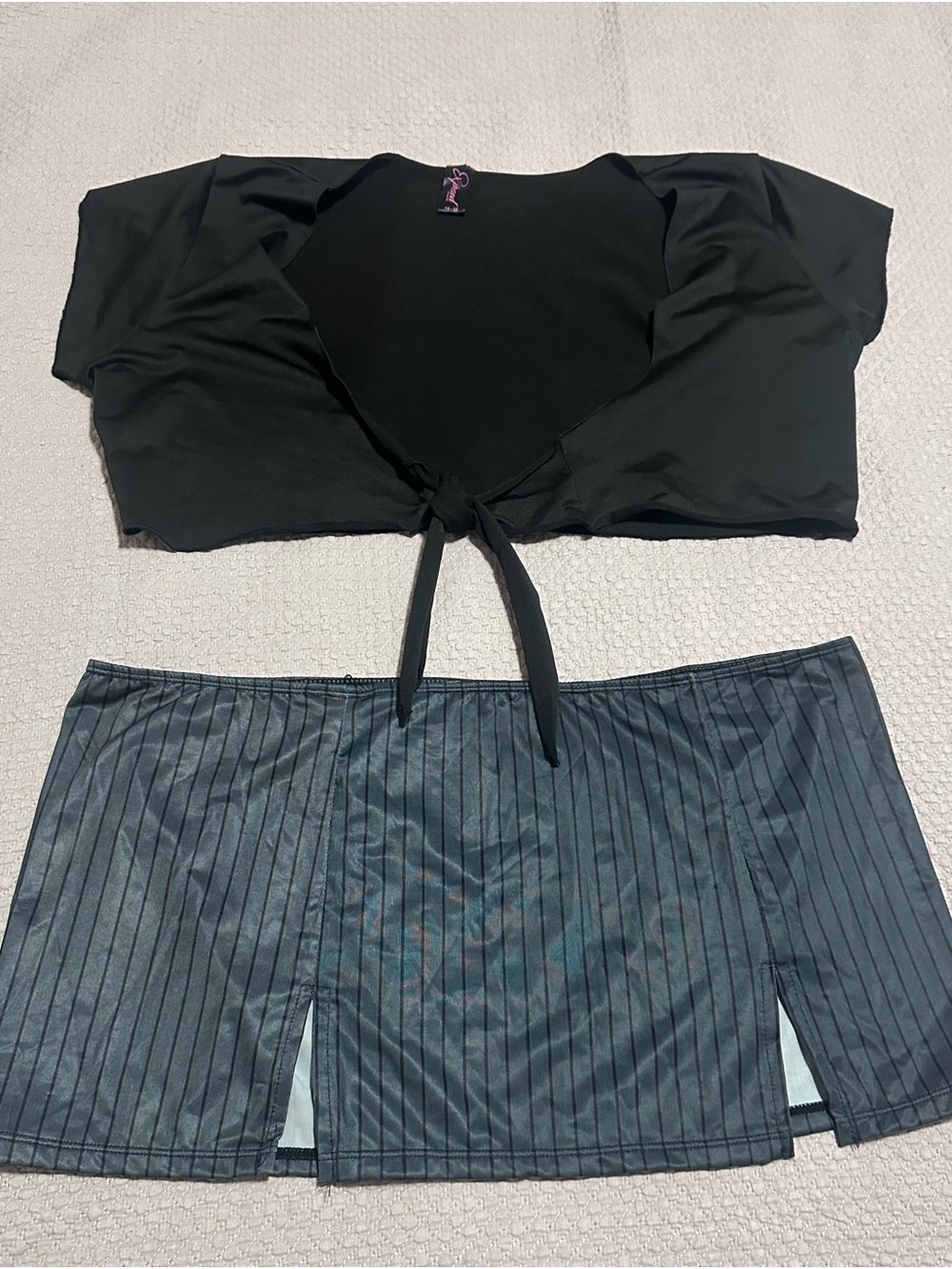 Black Tie-Front Bandeau Top and Pinstripe Mini Skirt Set.
